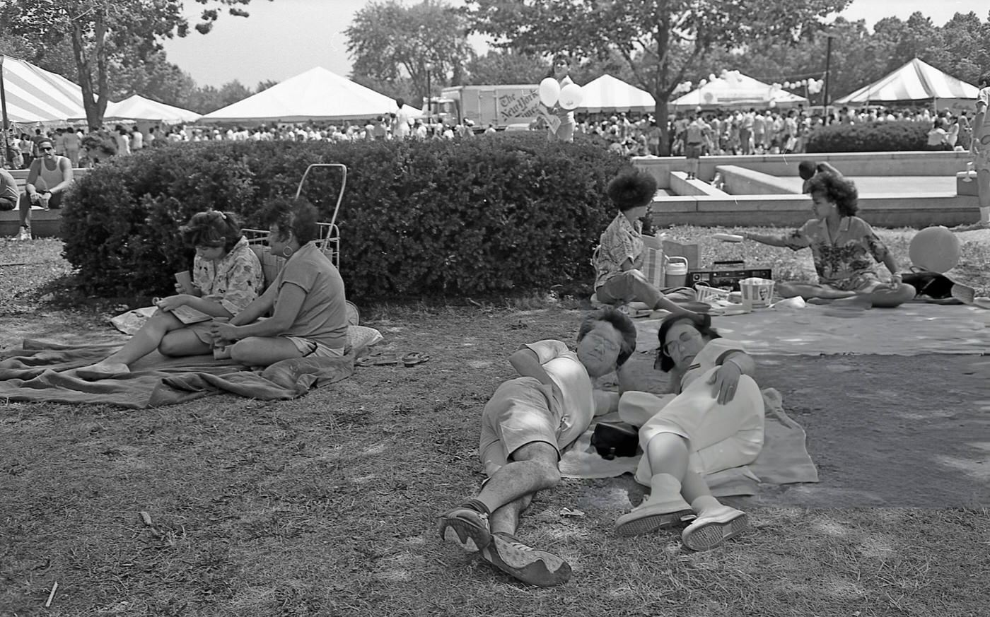 People Lie On The Grass In Flushing Meadows Park, Corona, Queens, 1986.