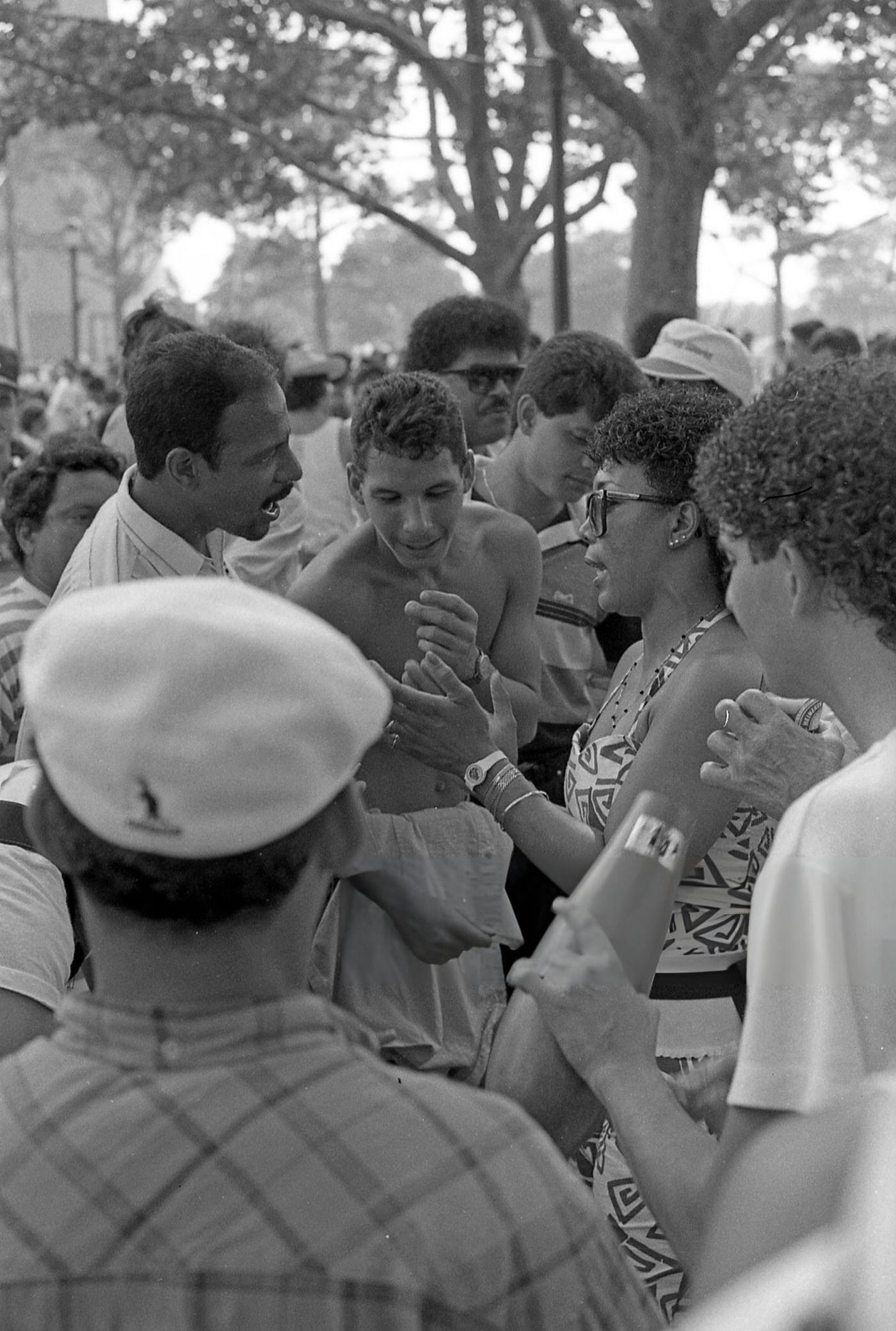 A Group Of People Talk In Flushing Meadows Park, Corona, Queens, 1988.