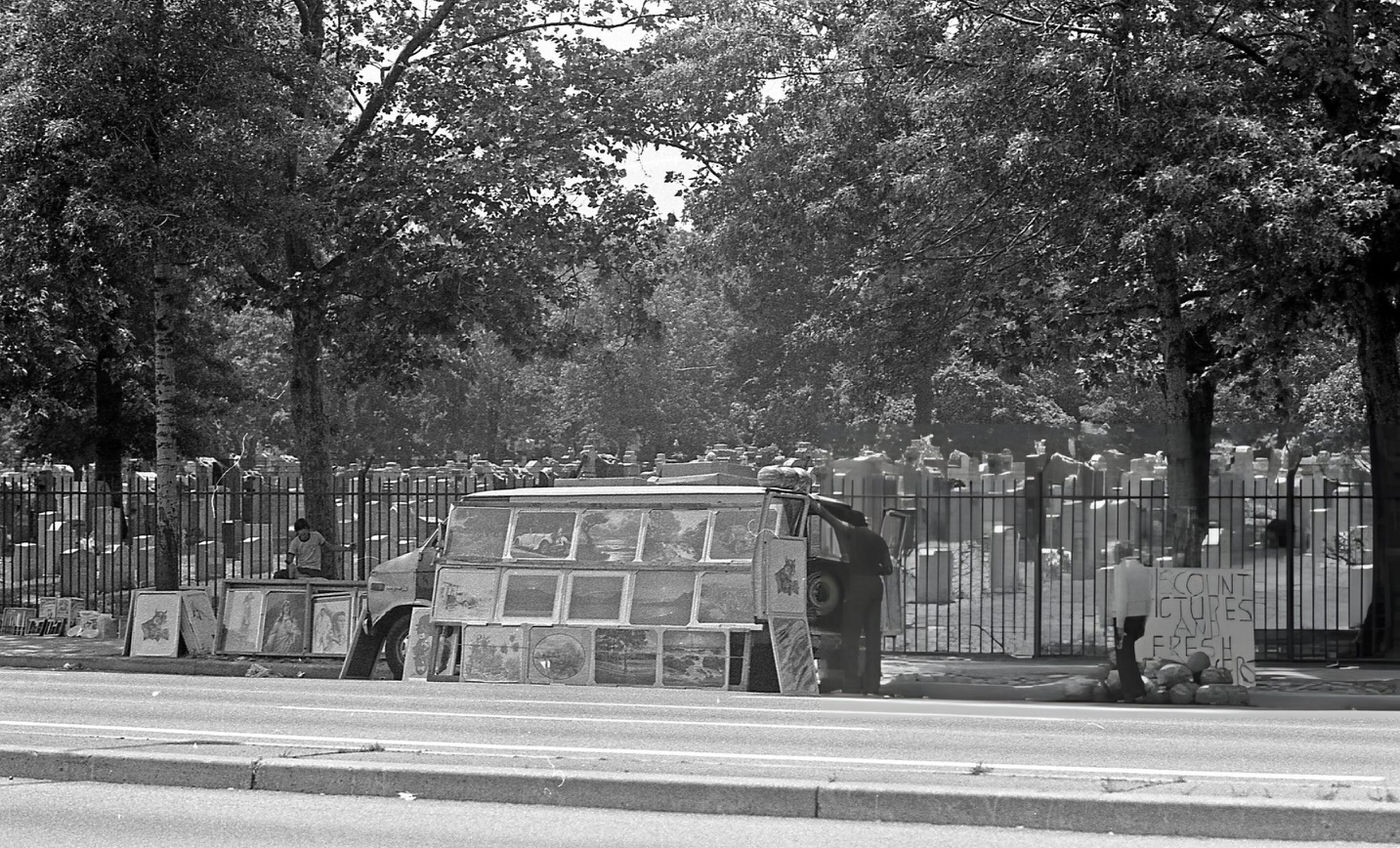 A Vendor Sells Framed Artwork From The Back Of A Van In Rego Park, Queens, 1981.