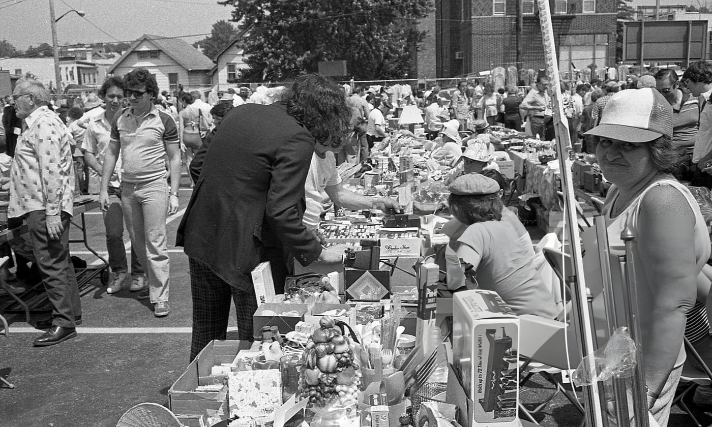 People Browse Vendor'S Tables At An Outdoor Flea Market In Maspeth, Queens, 1981.