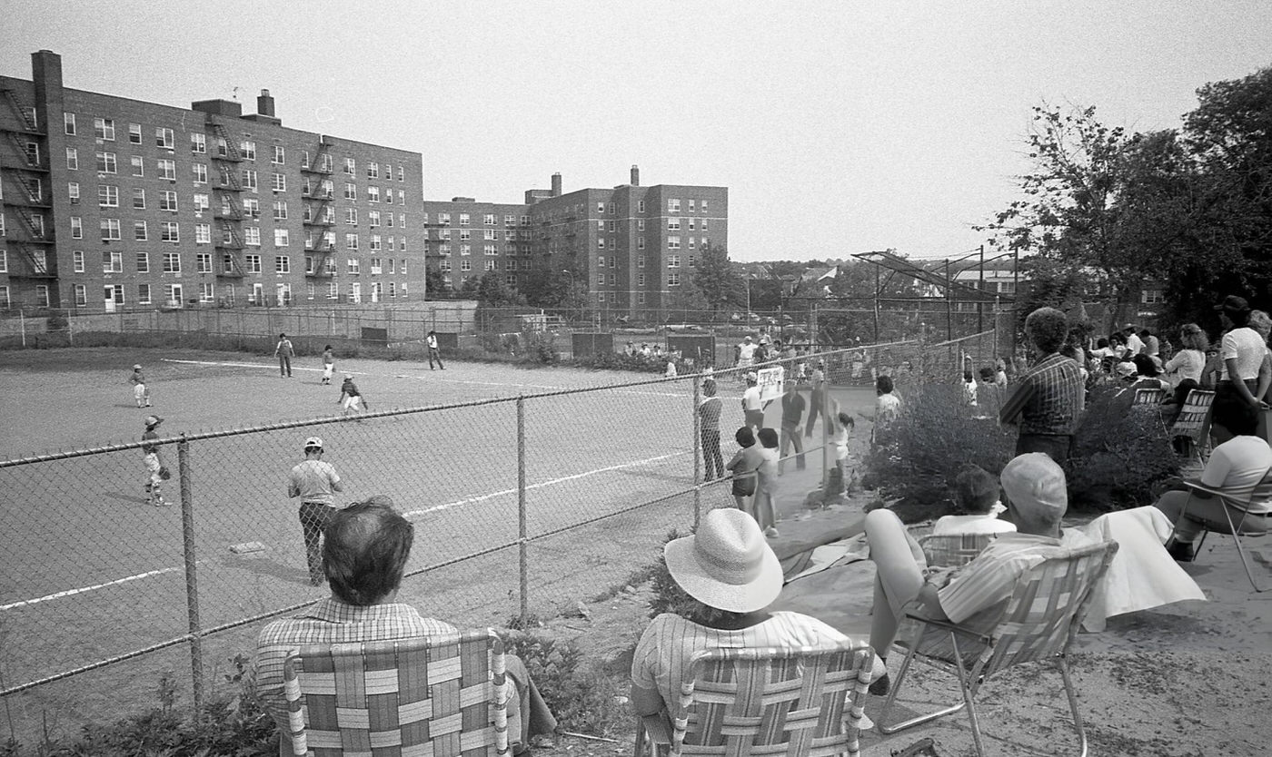 Spectators Watch A Little League Baseball Game At The Fleet Street Fields In Rego Park, Queens, 1981.