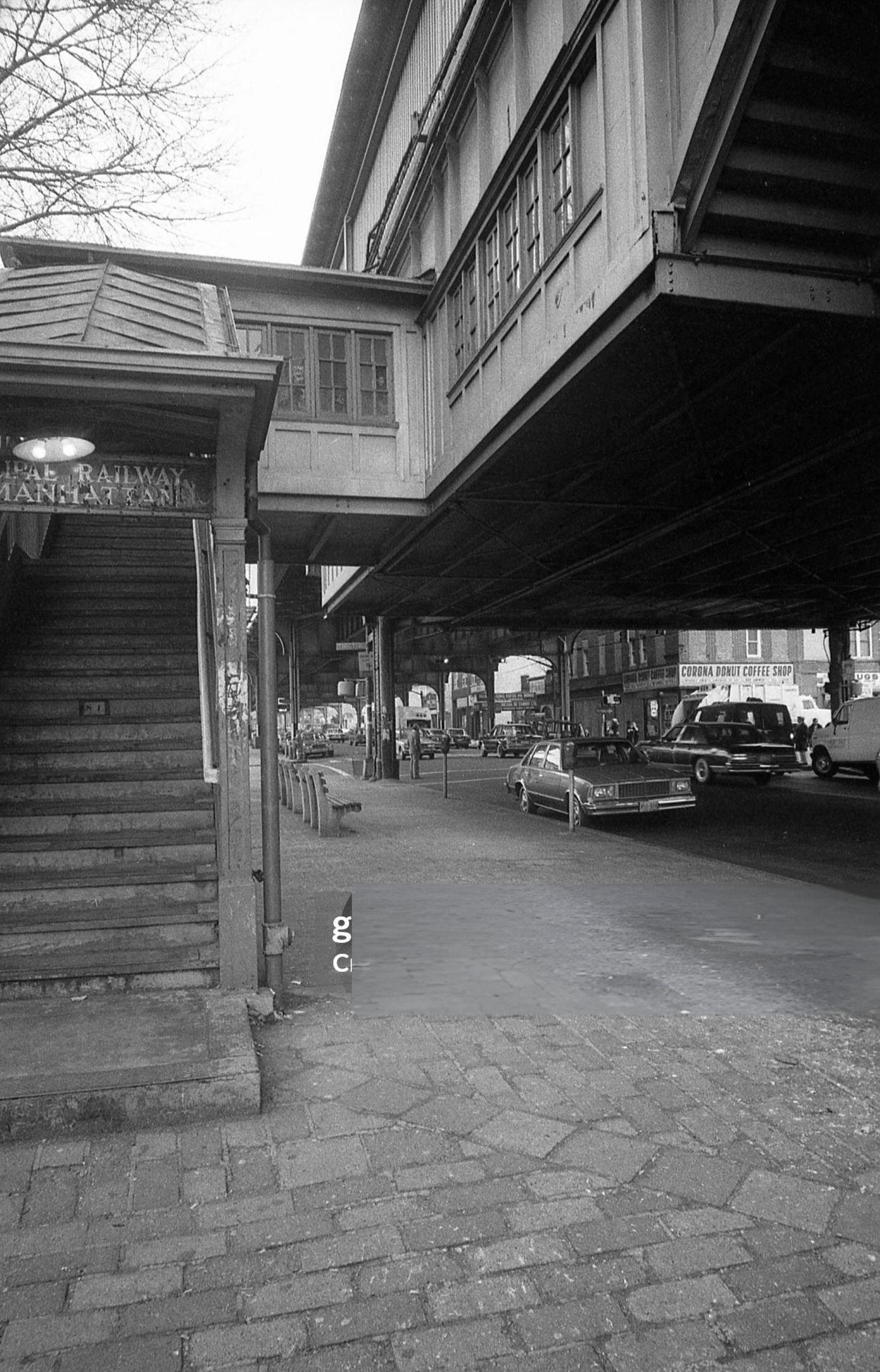 A Staircase Leads To The Elevated Subway Line At The Intersection Of Roosevelt Avenue And National Street In Corona, Queens, 1982.
