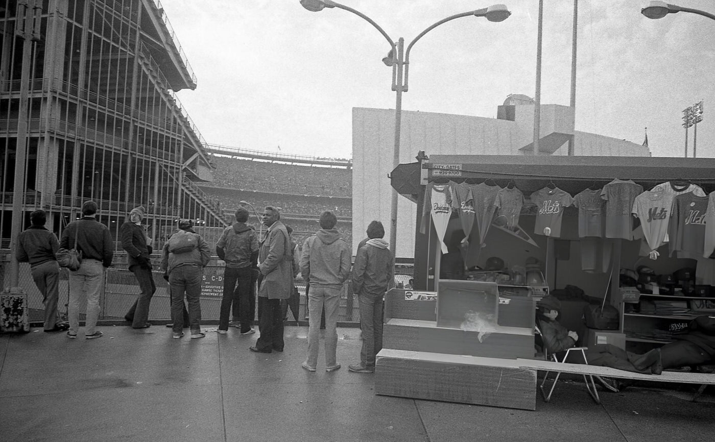 Fans Watch An Opening Day Baseball Game From Outside Shea Stadium In Corona, Queens, 1982.