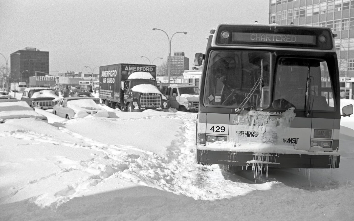 A Stranded City Bus And Other Vehicles On Queens Boulevard In The Aftermath Of A Blizzard In Rego Park, Queens, 1983.