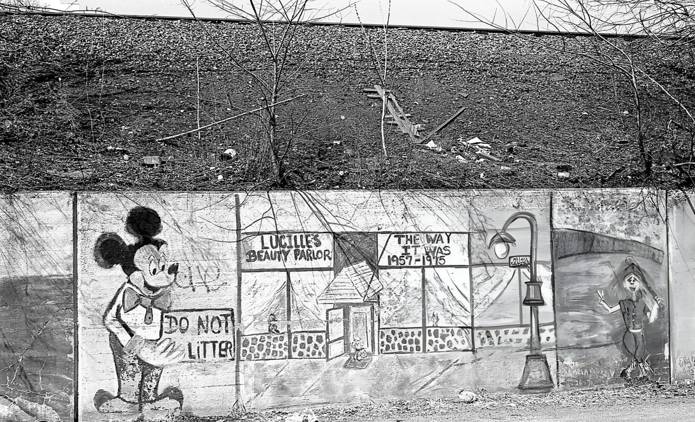 Graffiti On A Retaining Wall Along 45Th Avenue In Corona, Queens, Featuring Mickey Mouse With An Anti-Littering Message, 1984.