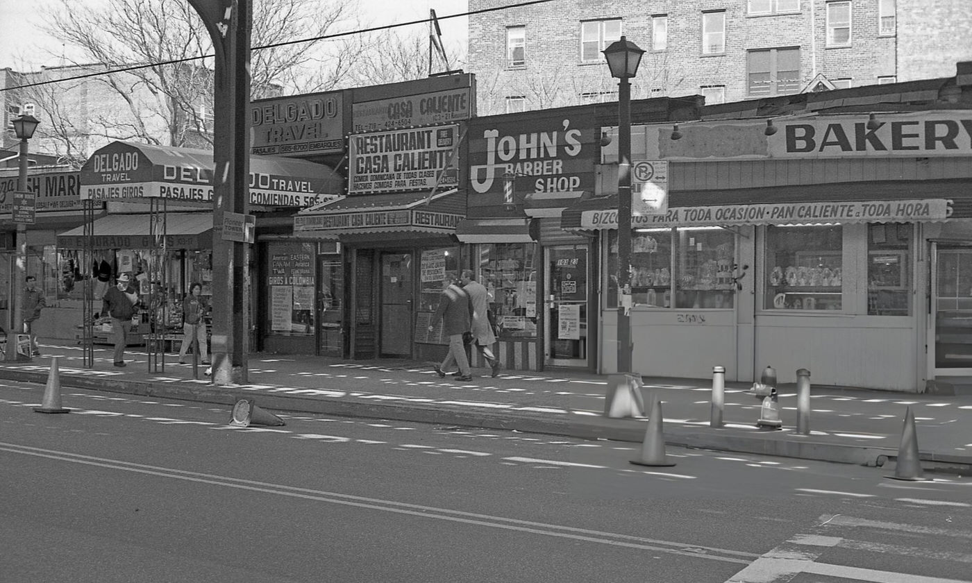 Delgado Travel, Restaurant Casa Caliente, John'S Barber Shop, And A Bakery On Roosevelt Avenue Near 104Th Street In Corona, Queens, 1990S.