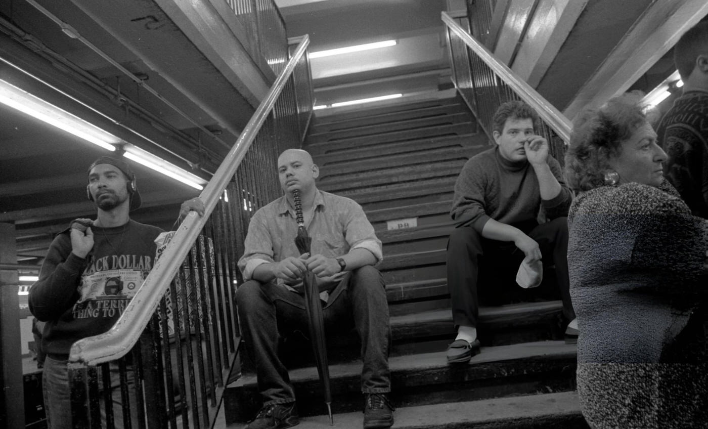 Commuters Sit On Steps And Stand On The Subway Platform At The Roosevelt Avenue Station In Jackson Heights, Queens, 1993.