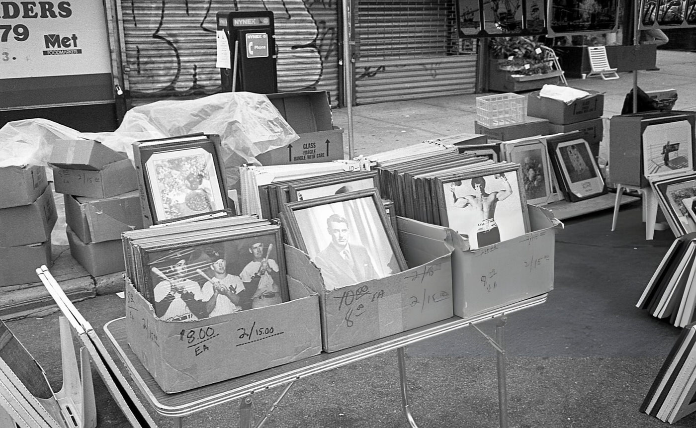 Boxes Filled With Framed Portraits Of Various Sports And Film Celebrities On 63Rd Drive During The 63Rd Drive Street Fair In The Rego Park Neighborhood, Queens, 1995.