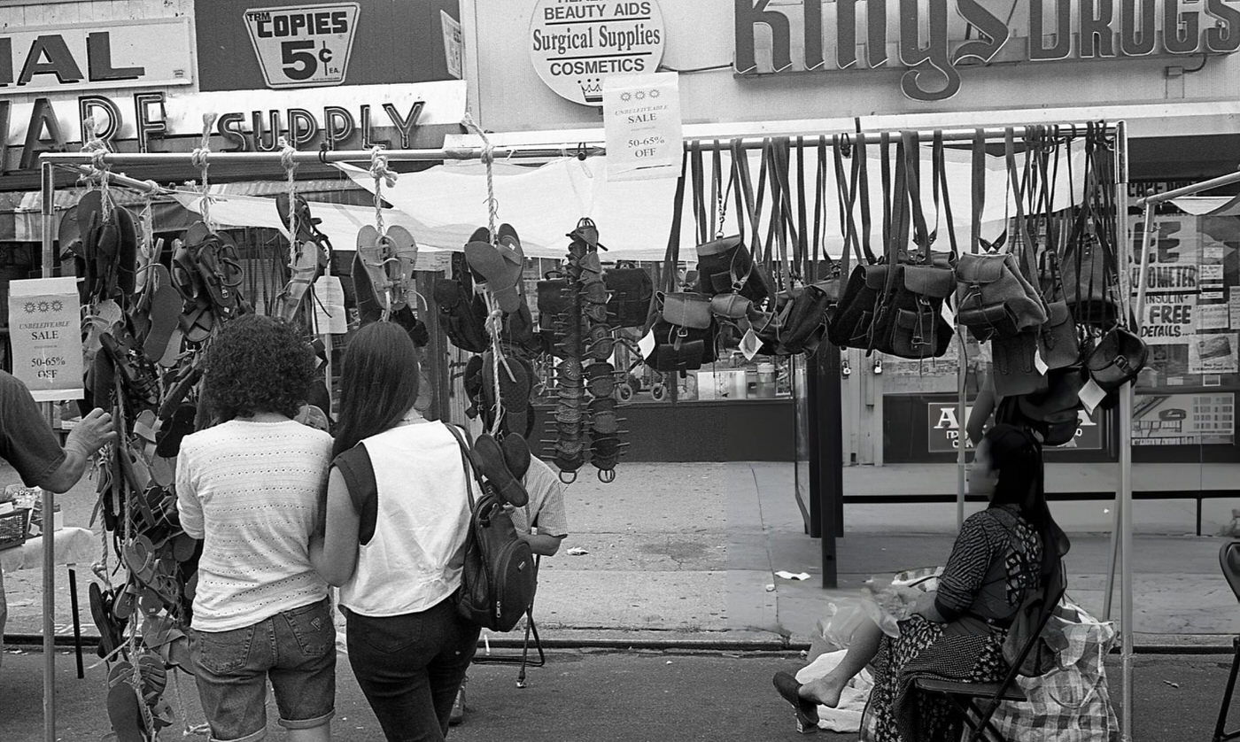 Pedestrians Browsing Purses And Flip Flops At One Of The Stalls On 63Rd Drive During The 63Rd Drive Street Fair In The Rego Park Neighborhood, Queens, 1995.