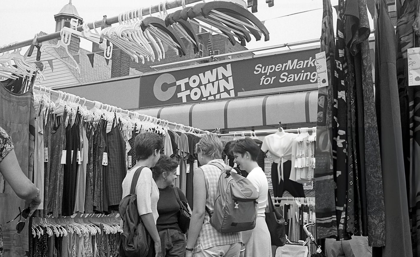Pedestrians Browsing Racks Of Clothing On 63Rd Drive During The 63Rd Drive Street Fair In The Rego Park Neighborhood, Queens, 1995.