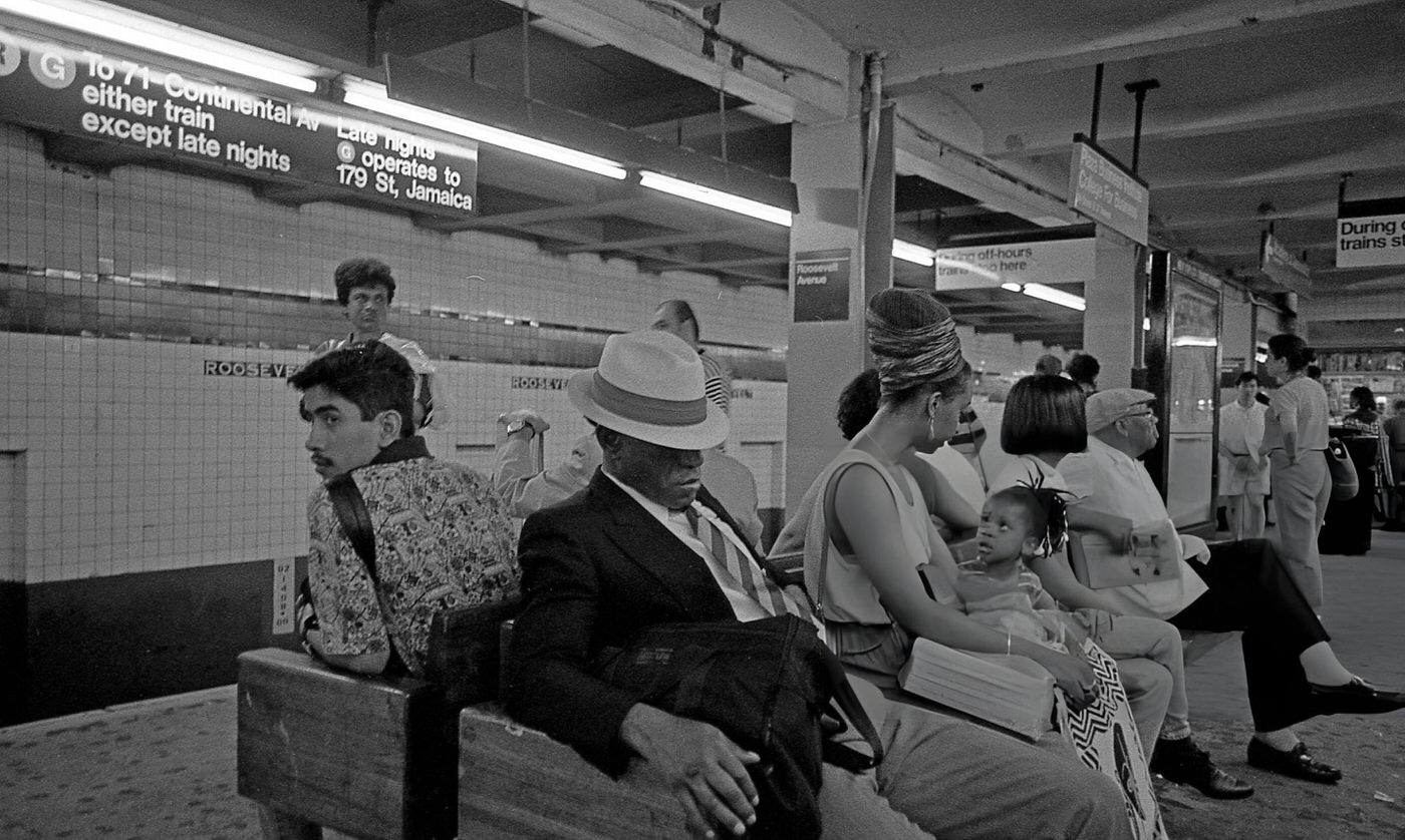 Commuters Waiting On The Subway Platform At Roosevelt Avenue In The Jackson Heights Neighborhood, Queens, 1995.