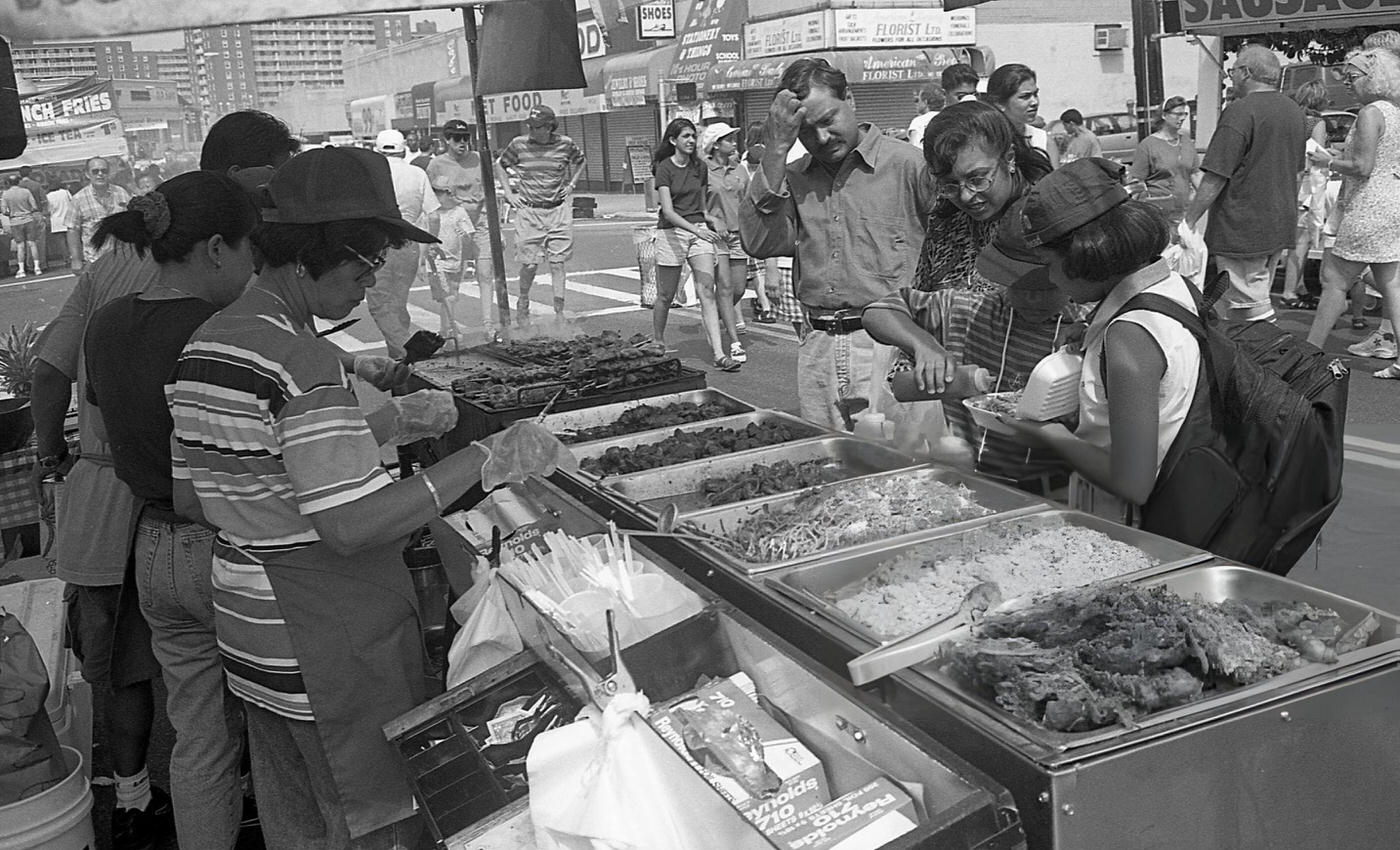 Vendors Prepare Food For Customers At A Stall On 63Rd Drive During The 63Rd Drive Street Fair, Rego Park, Queens, 1997.