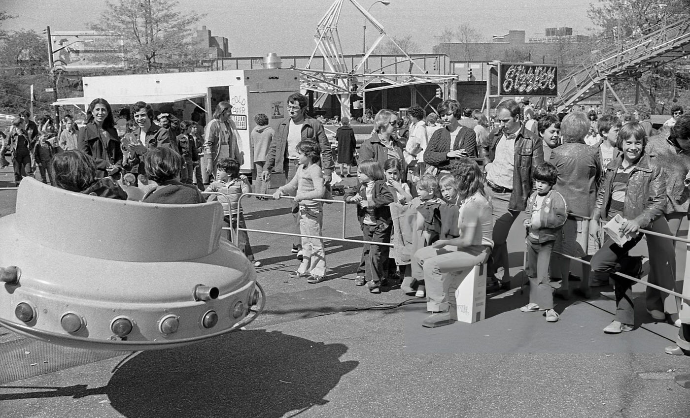A Group Of People Waiting In Line At One Of The Rides At The Resurrection Ascension Church Carnival In Rego Park, Queens, 1979.
