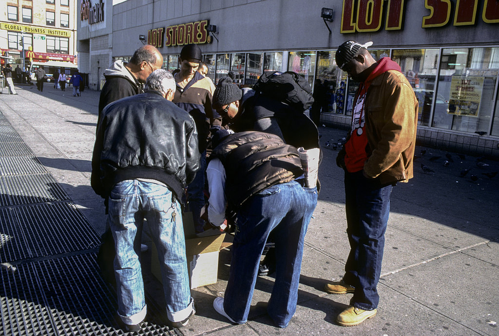 People Gathering Around A Box From Meals On Wheels, View North Along Lexington Ave. From E. 124Th St., Harlem, 2009.