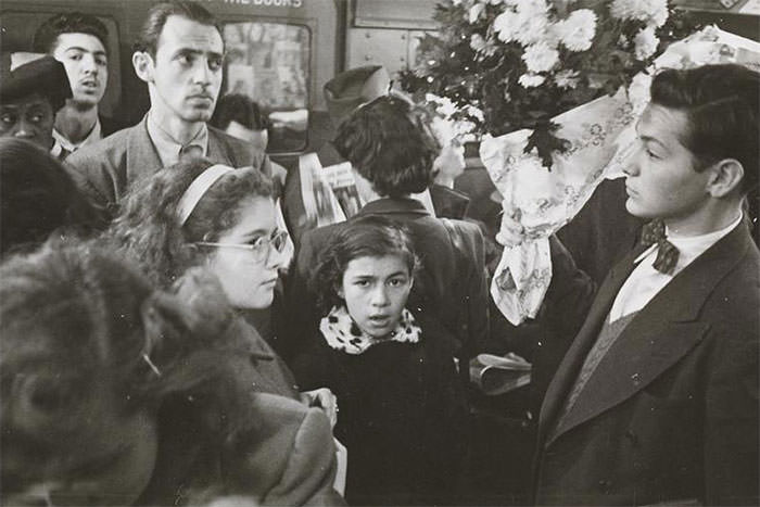 A Man Carrying Flowers On A Crowded Subway, 1946.