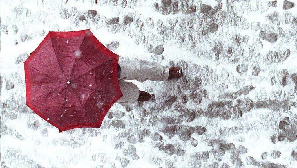 A Pedestrian Walks Among Tracks In The Snow 29 March During A Spring Snowstorm, 1996