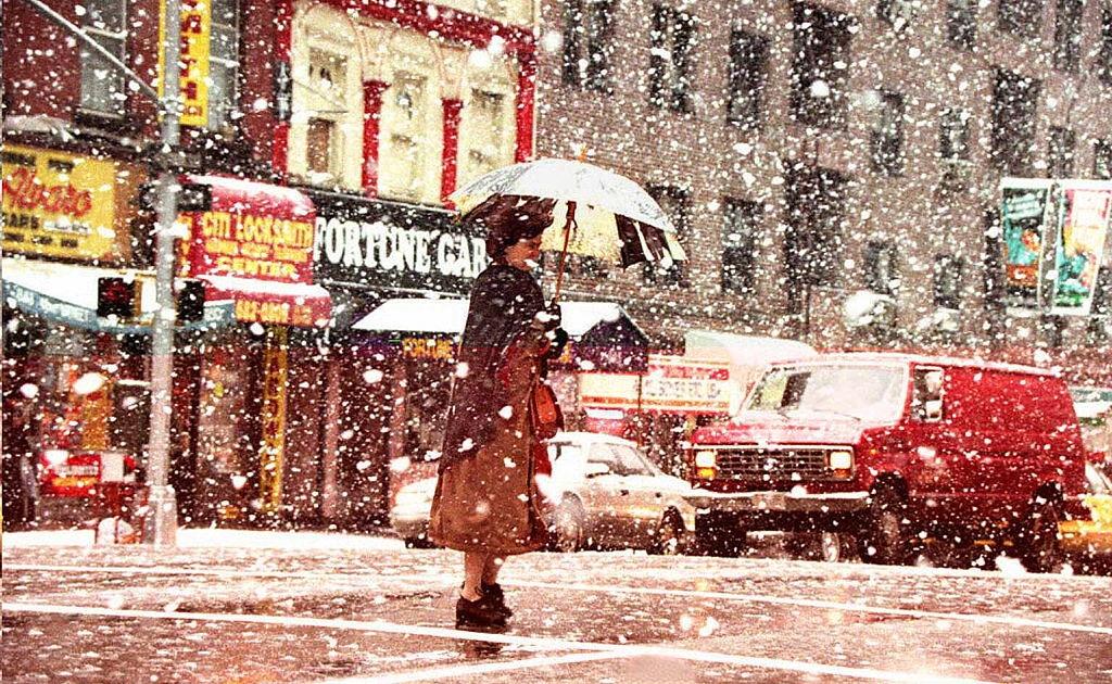 A Pedestrian Walks Across The Street In Heavy Snow 29 March During A Spring Snowstorm, 1996
