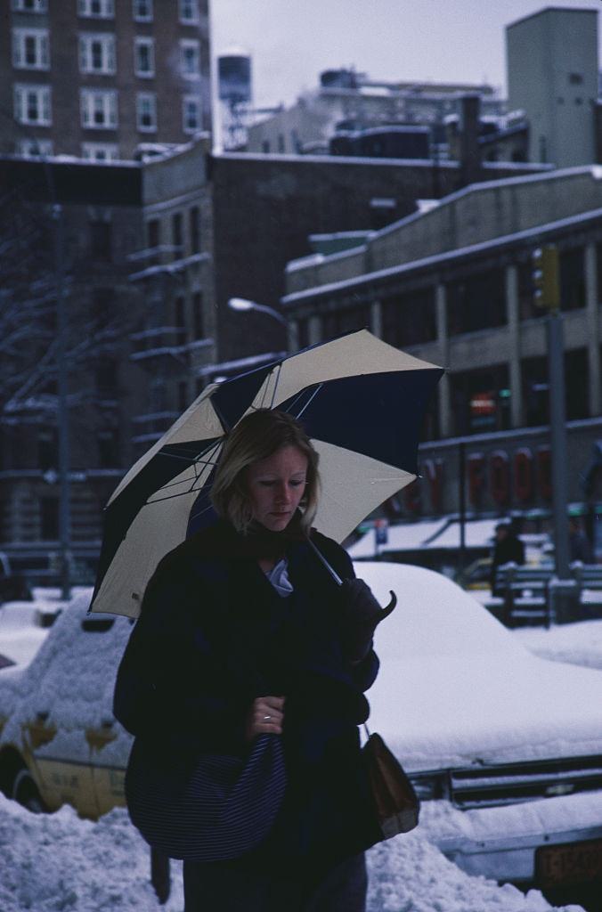 A Woman Walking Down A Street During The Blizzard Of January 1996.