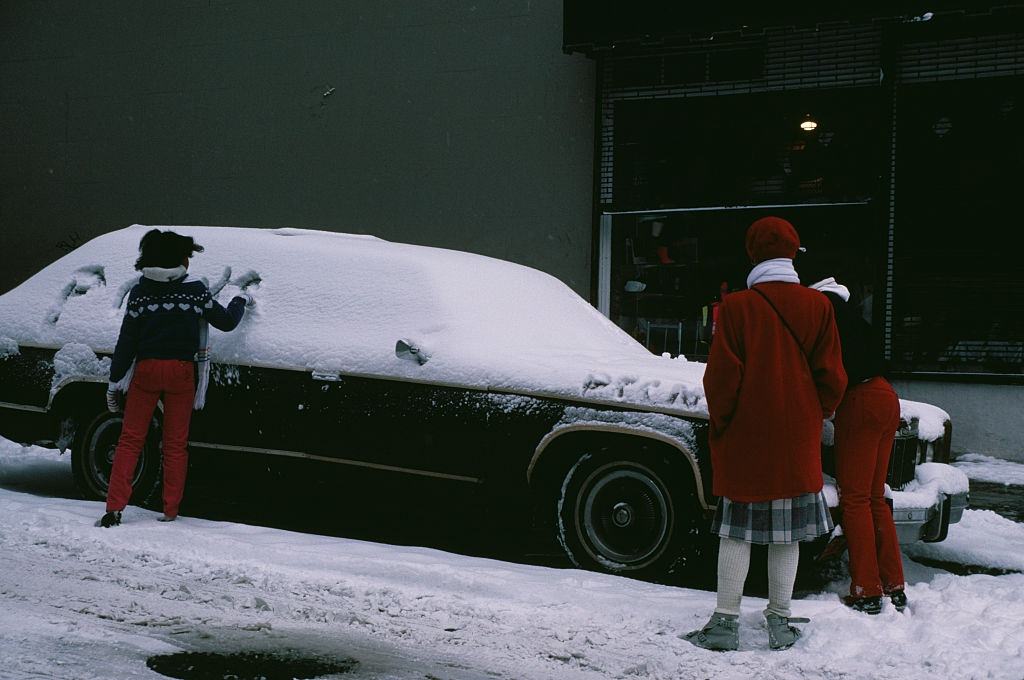 A Girl Writing In The Snow Covering A Car, 1996.