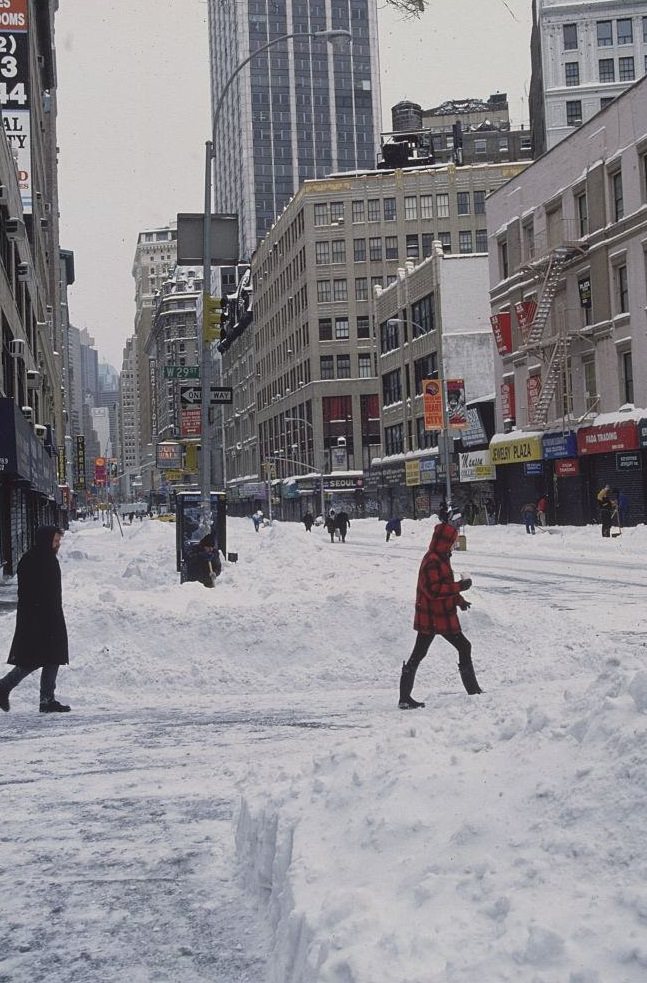 Pedestrians Walking Across Snow-Covered Street, 1996