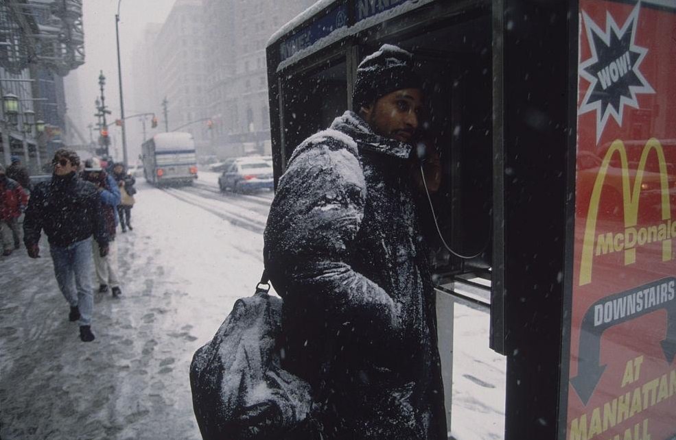Man In Snow-Covered Coat Talking On Pay Phone, 1996