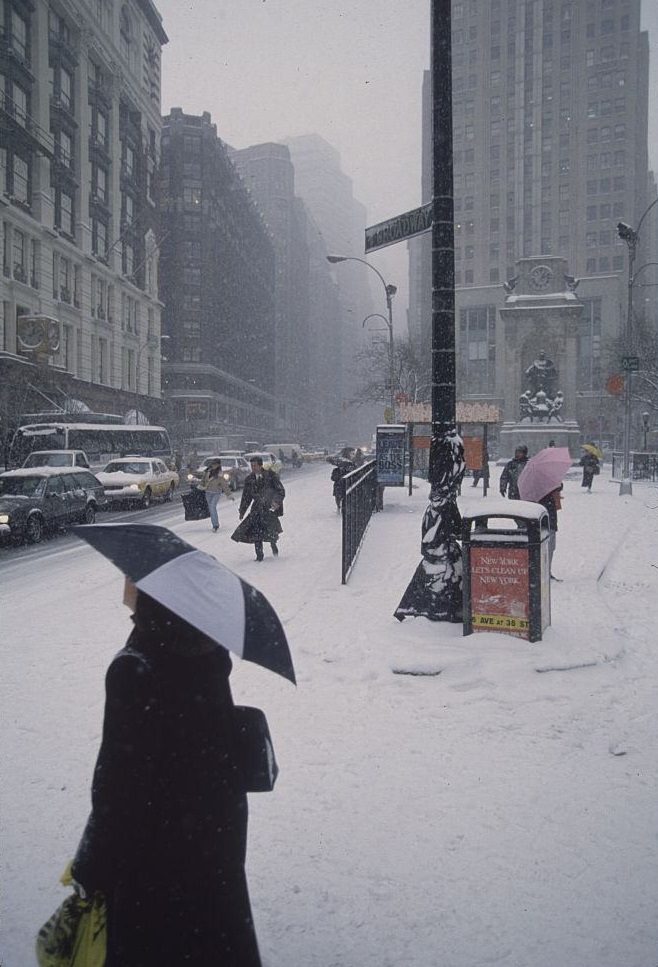 Pedestrians Carrying Umbrellas On Street During Snowstorm, 1996