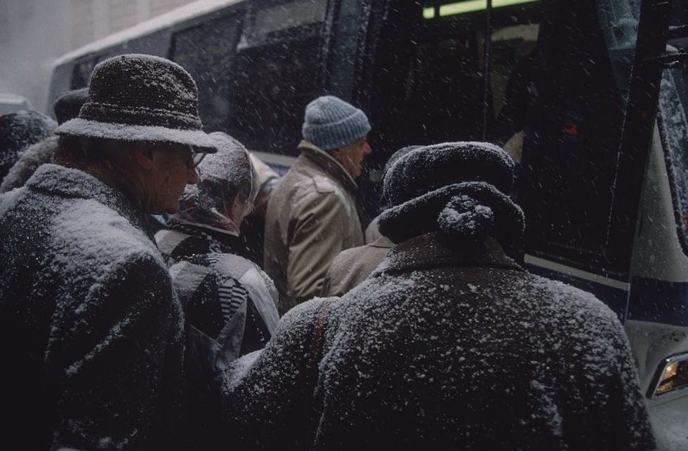 Snow-Covered People Boarding Bus During Snowstorm, 1996