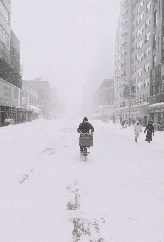 Man On Bicycle Riding In Empty, Snowy Street, 1996