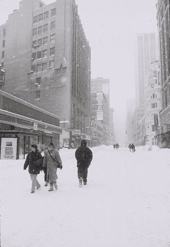 Pedestrians Walking In Empty, Snow-Covered Street, 1996