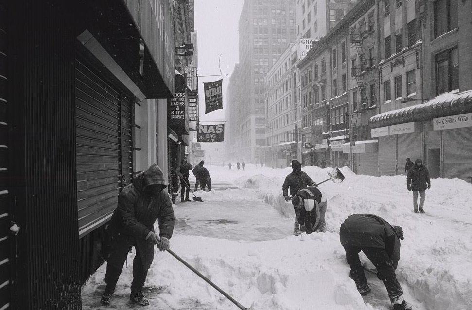 People Removing Snow From Sidewalk Using Shovels, 1996