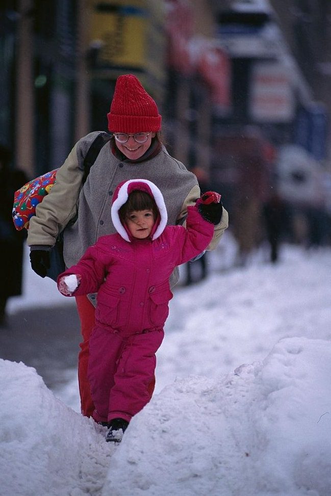 Mother And Daughter Walking Through Snow, 1996