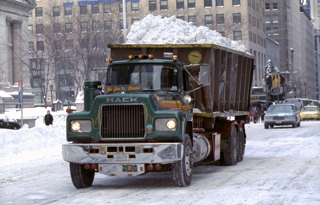 Dump Truck Heads Down Fifth Ave. With A Load Of Snow To Be Dumped Into The East River After A Blizzard, 1996