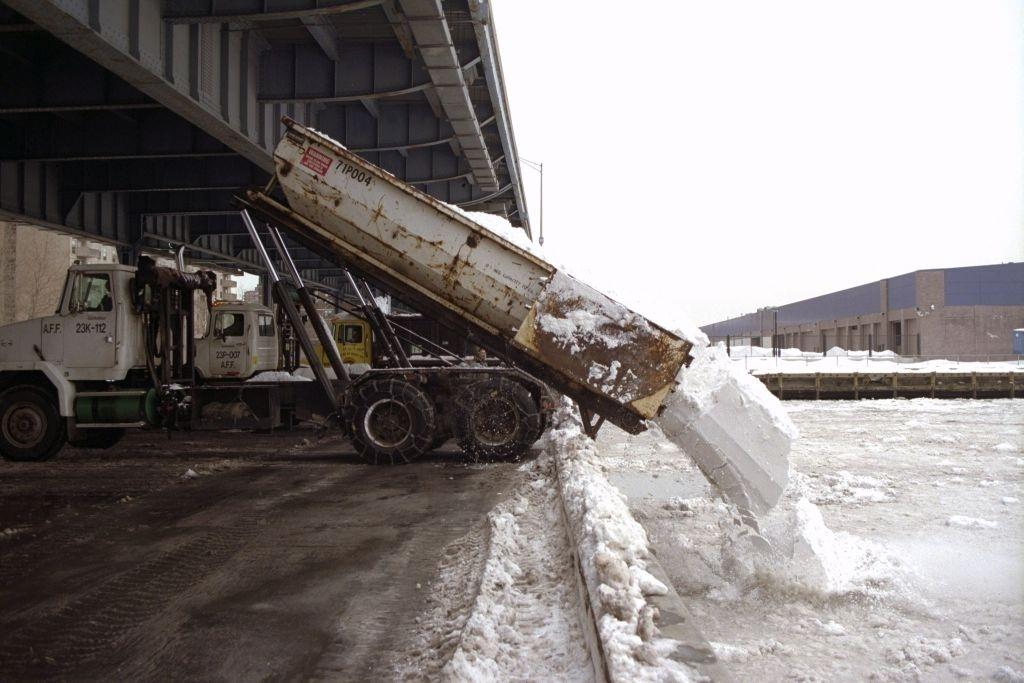 Trucks Dump The Snow From City Streets Into The East River At Dike And South Streets After A Blizzard, 1996