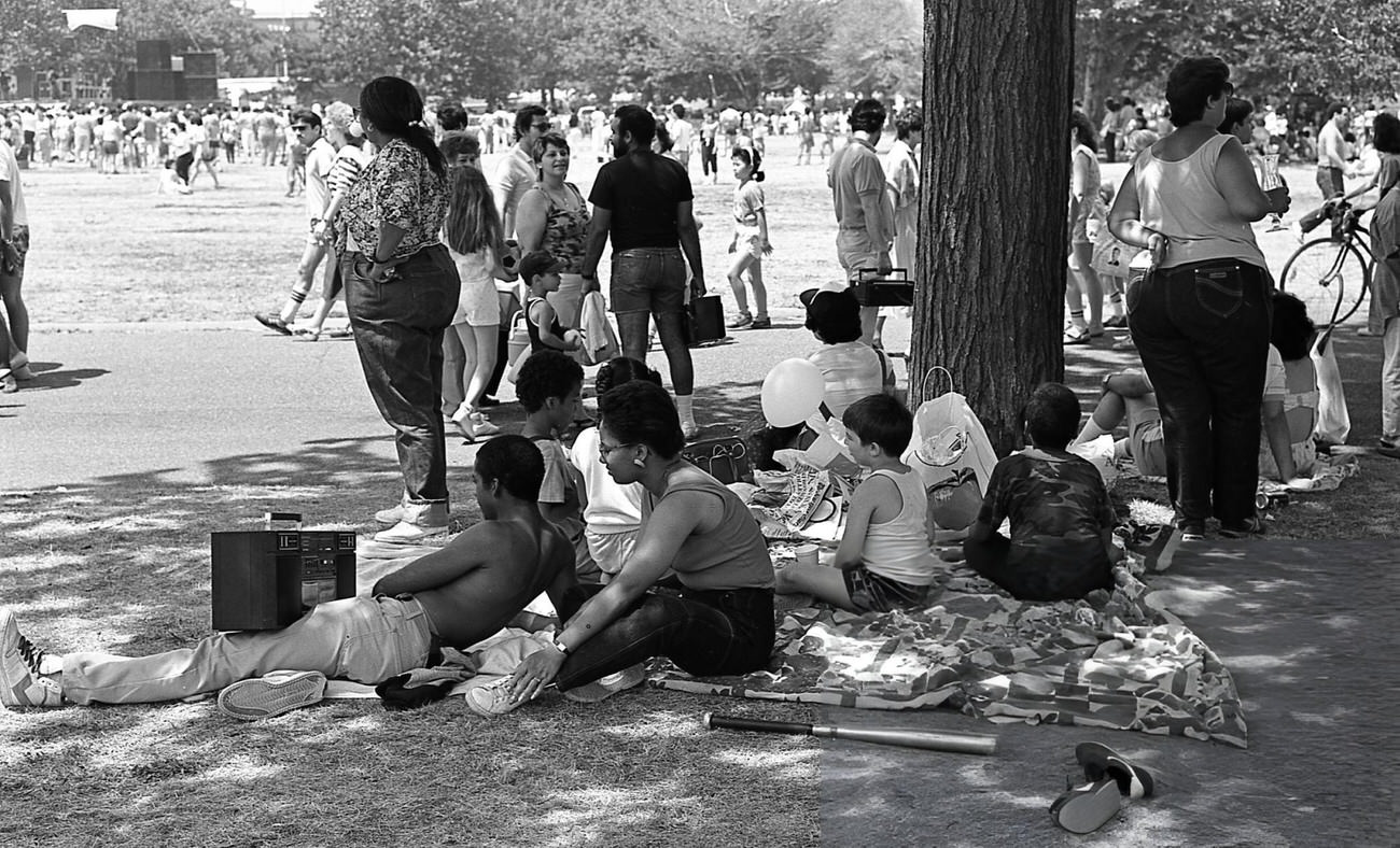 A Family Relaxing On The Grass At Flushing Meadows Park With A Boombox, Queens, 1986.