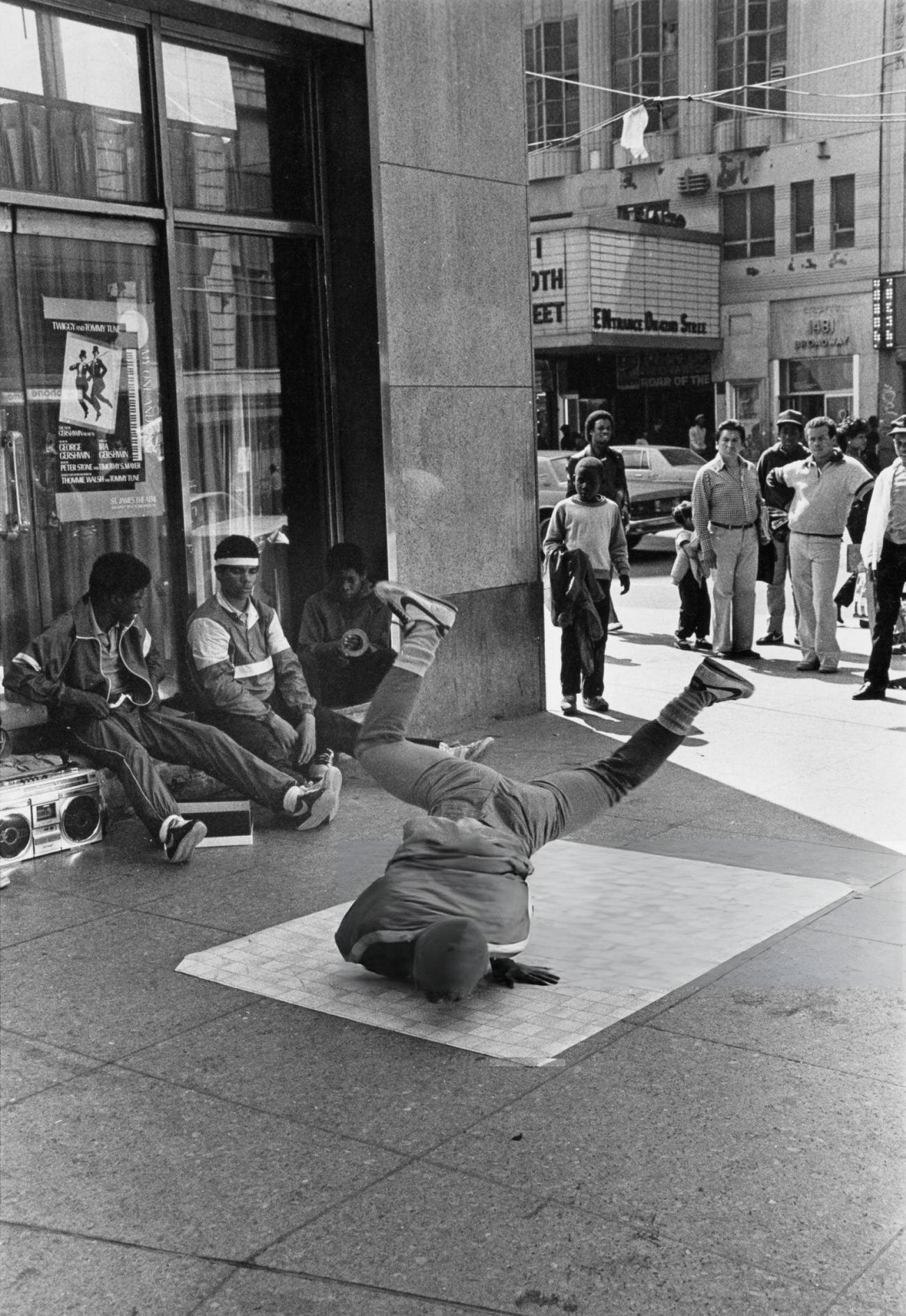 A Youth Windmills On A Piece Of Linoleum In Times Square With Boombox, 1980S.
