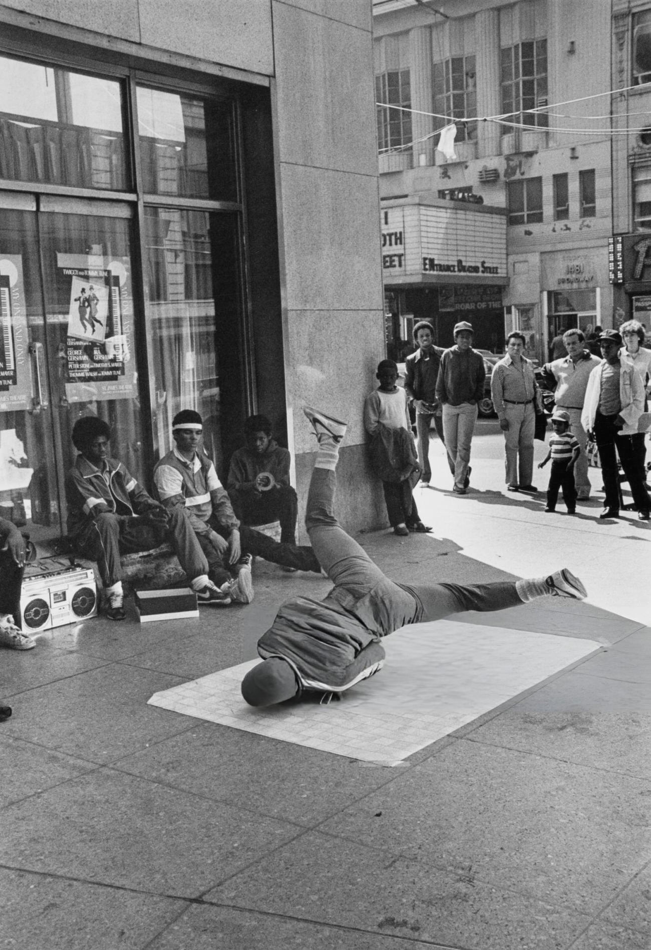 A Youth Windmills On A Piece Of Linoleum In Times Square With Boombox, 1980S.