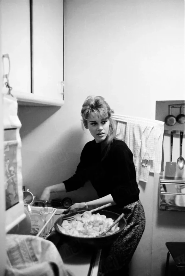 Jane Fonda Prepares Dinner For A Night Out With Friends In Her New York Apartment, November 1959.