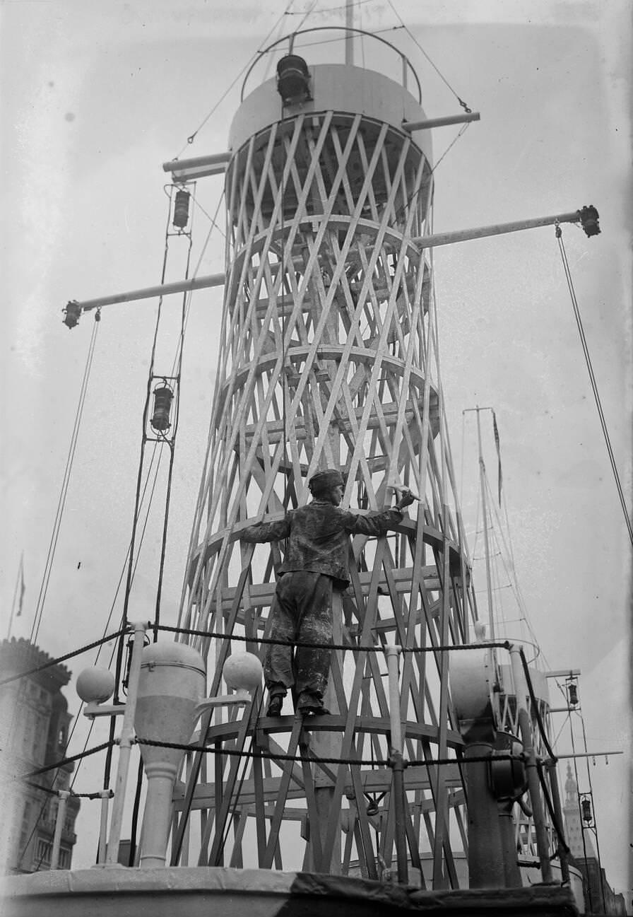 A Worker Camouflaging A Lattice Mast On The Uss Recruit, 1910S.