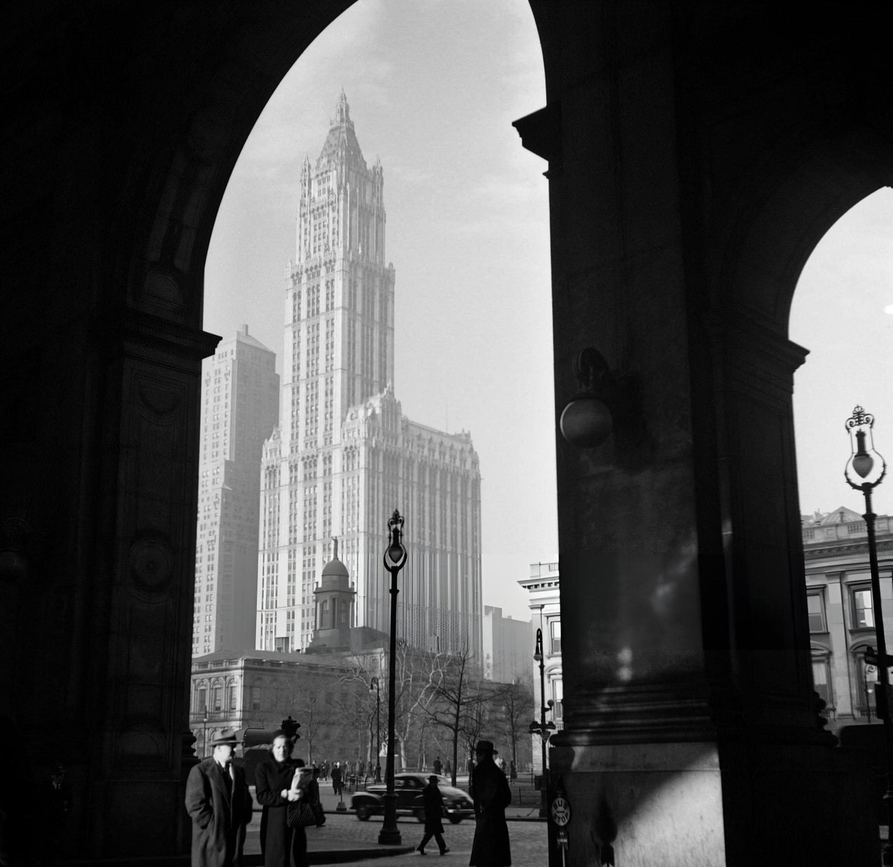 New Yorkers Wait At A Bus Stop On Broadway, Near City Hall, 1947.