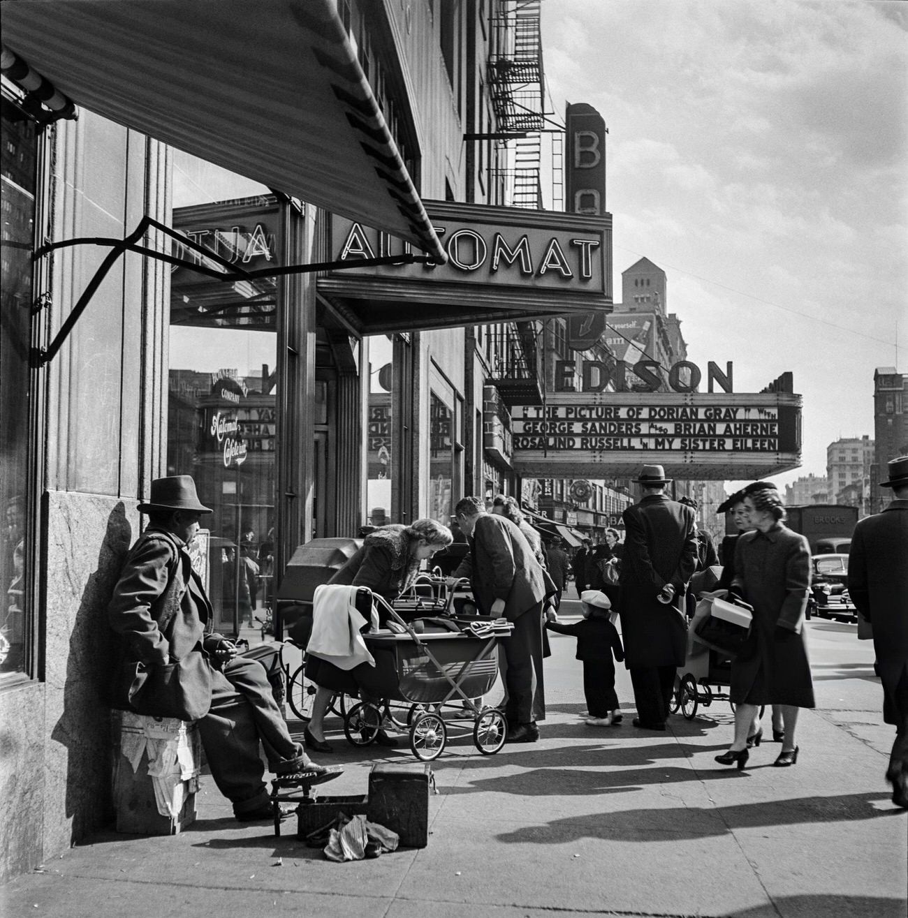 A Shoeshine Man Rests On A Sidewalk Of Broadway Near The Edison Theatre, 1947.