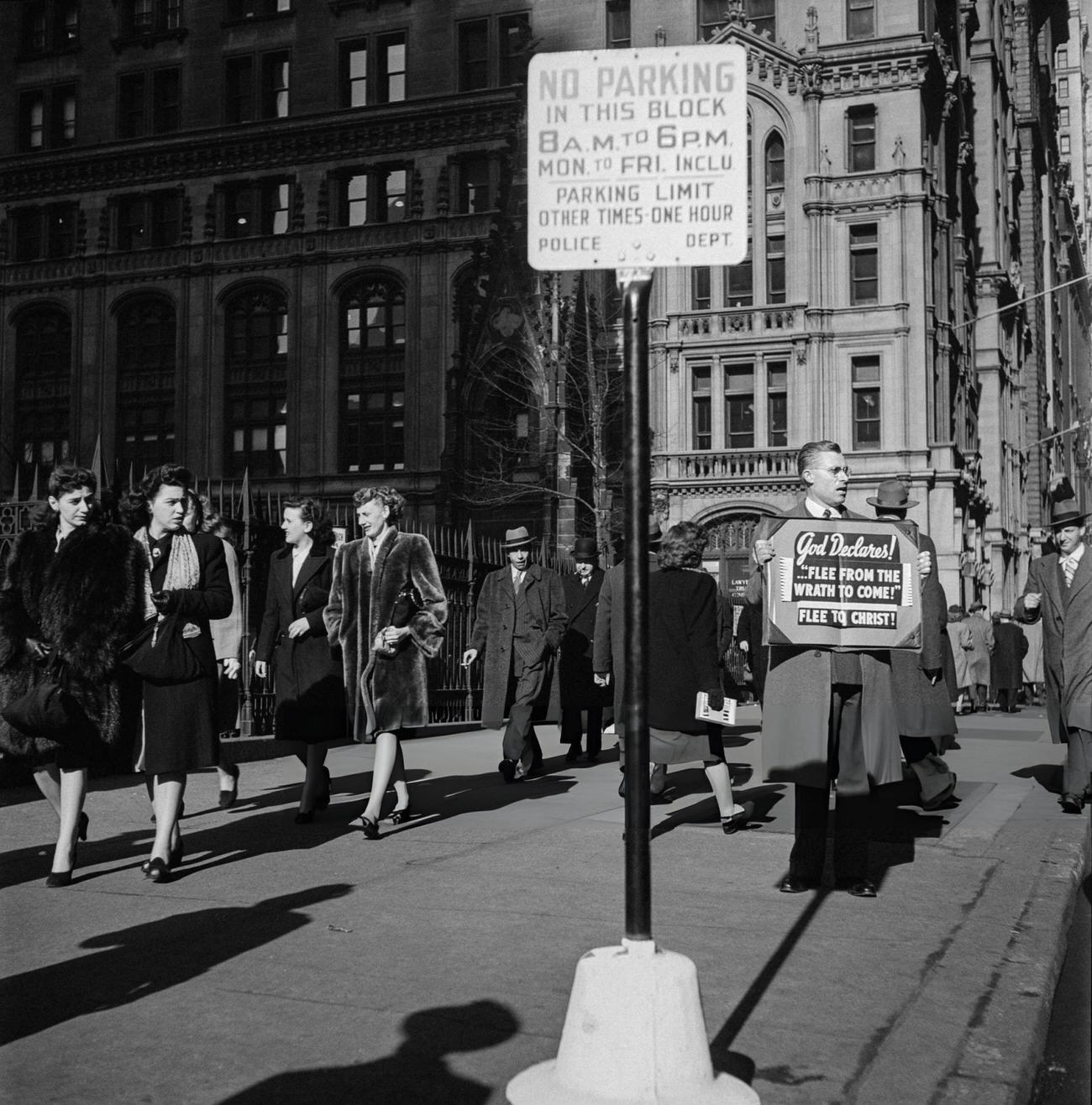 New Yorkers Pass By A Man Preaching The God'S Message Along The Gates Of Trinity Church, 1947.