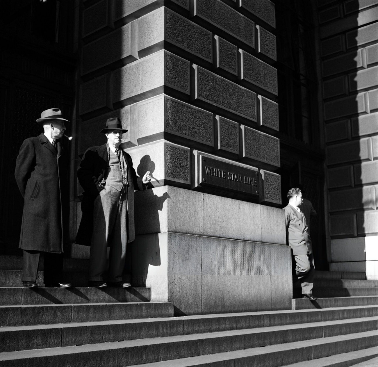 Men Enjoy The Sun On The Stairs Of The Cunard Building On Broadway, 1947.