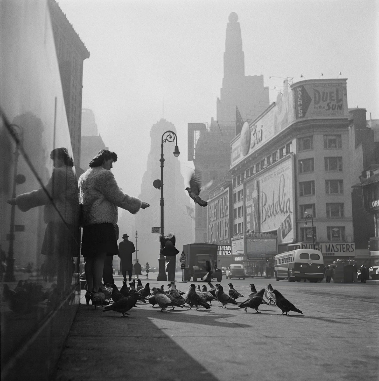 A Young Woman Feeds Pigeons On Broadway, 1947.