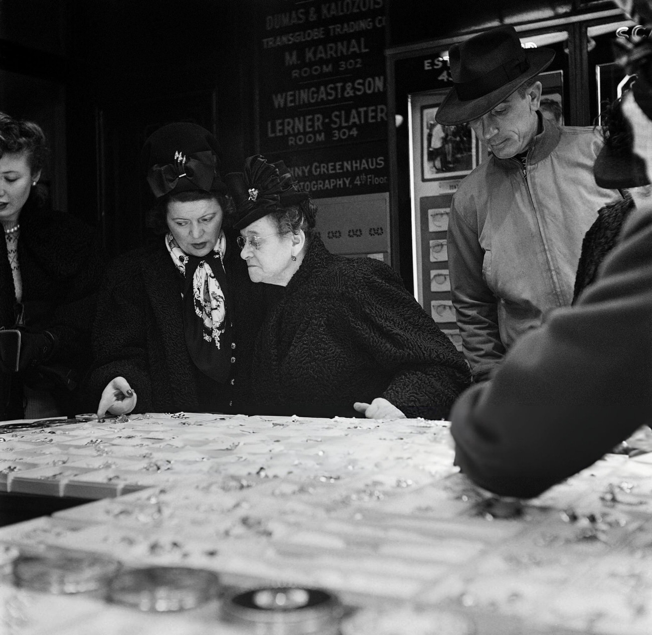 A Woman Chooses A Jewel With The Help Of An Elderly Lady In A Jewelry Shop, 1947.