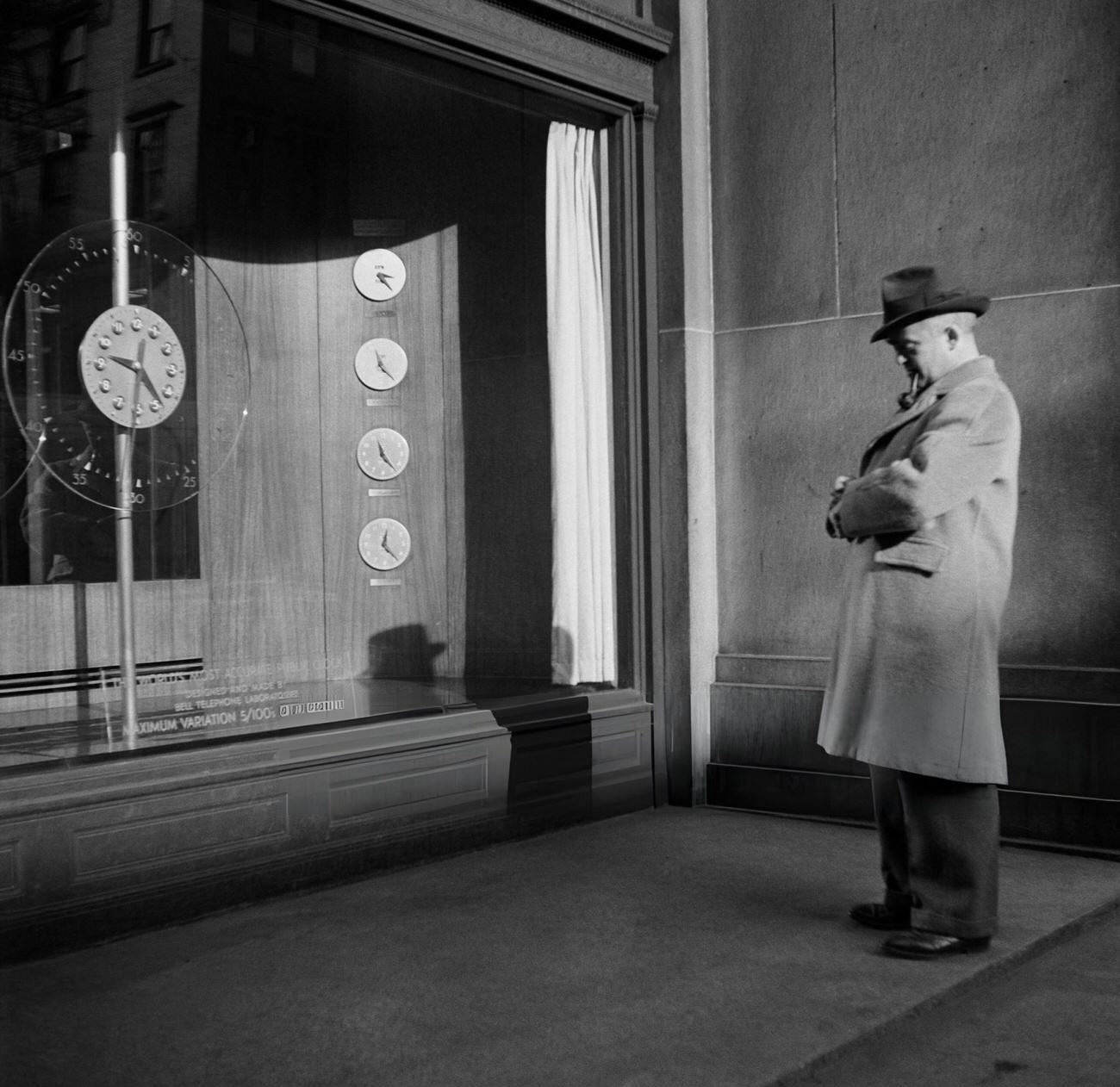 A Man Adjusts His Watch To The Clocks Displayed In The Telephone Building, 1947.