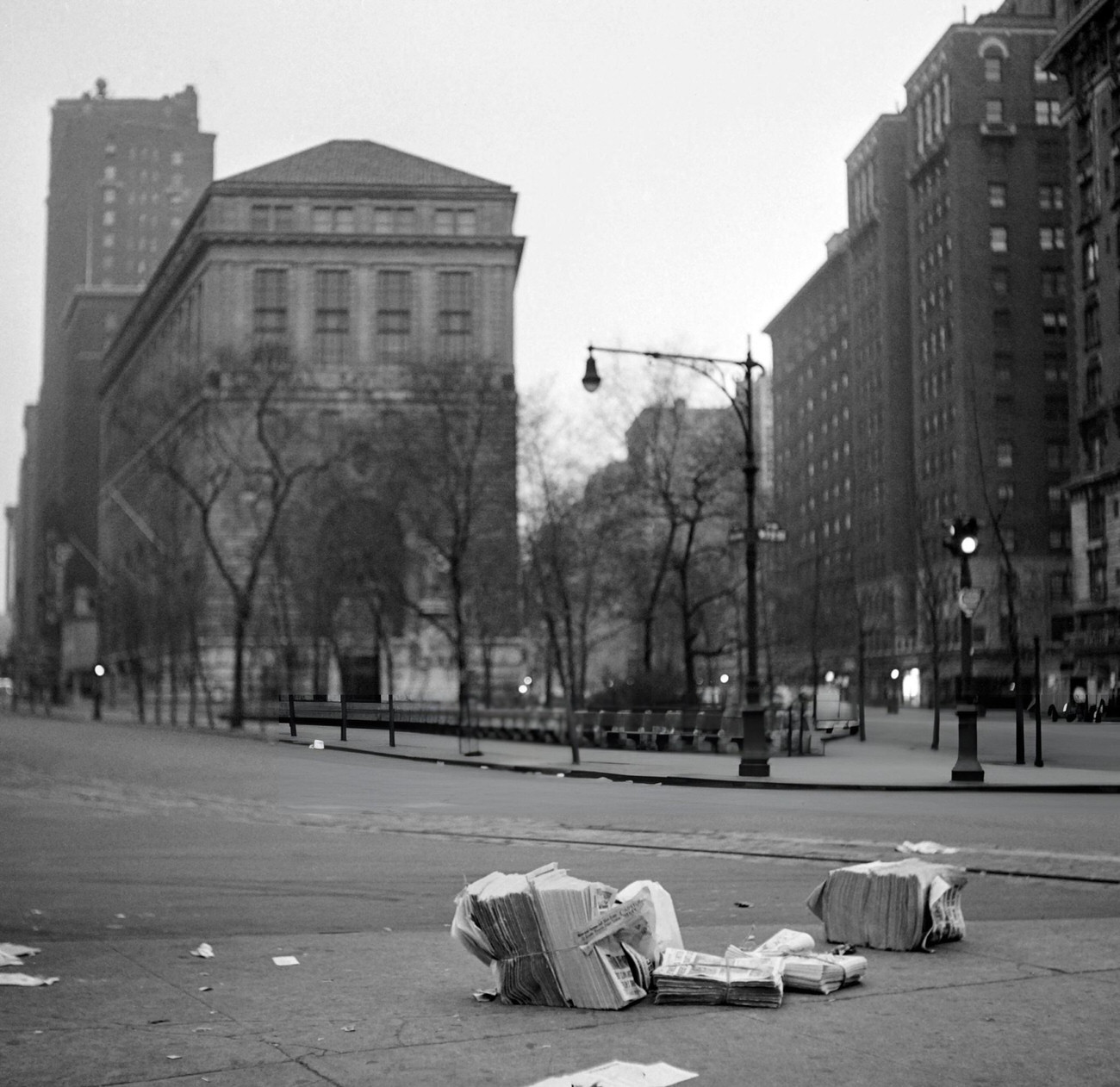 Unsold Newspapers Lie On The Pavement Early In A Morning, 1947.