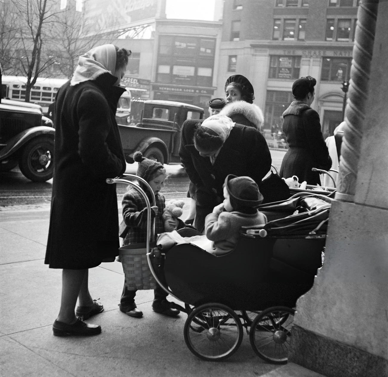 Nannies, Including Afro-American Women, Wait With Children In Baby Carriages, 1947.