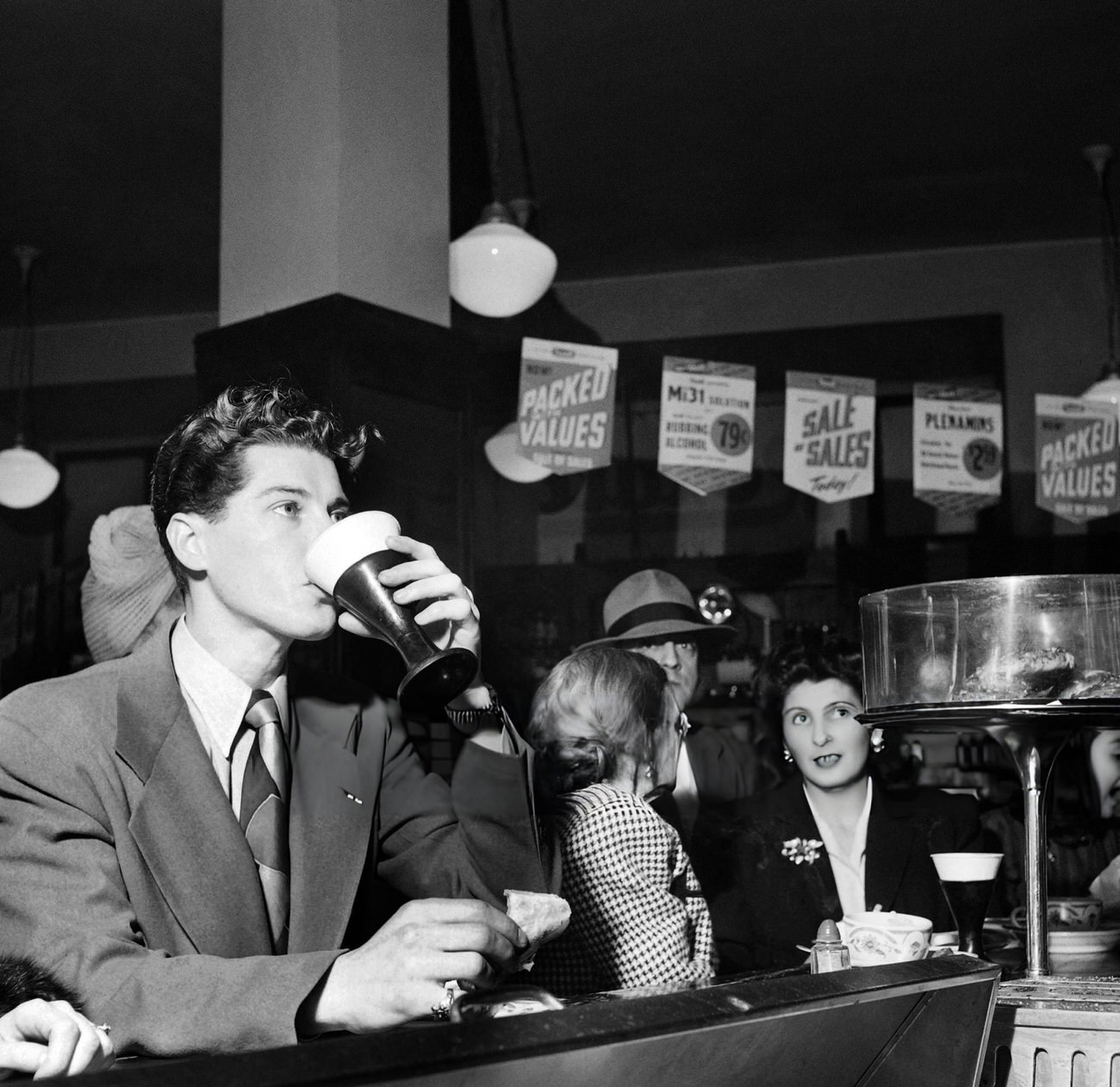 A New Yorker Has A Drink In A Drugstore On Broadway, 1947.