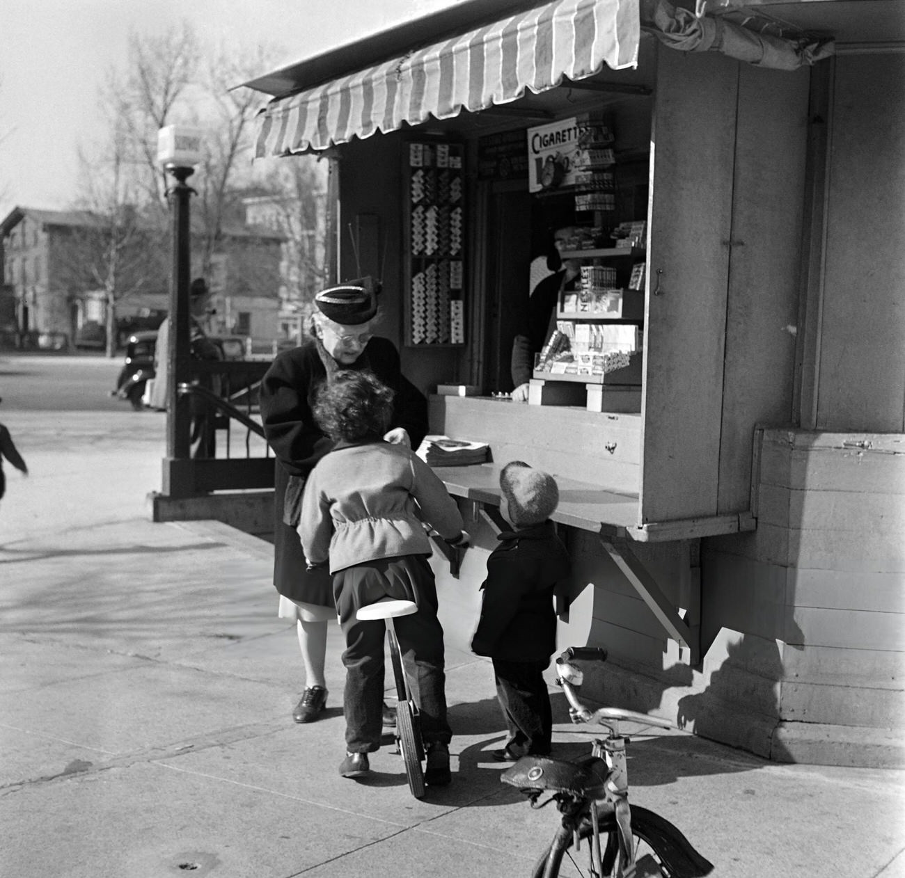 An Old Woman Buys Candies For Her Grandchildren At A Candy Stand, 1947.