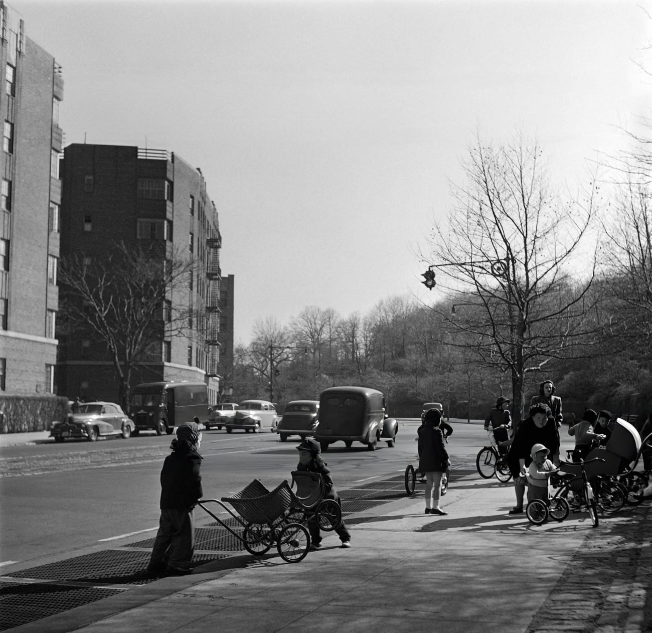 Children Play On A Sidewalk Before Going To A Park, 1947.